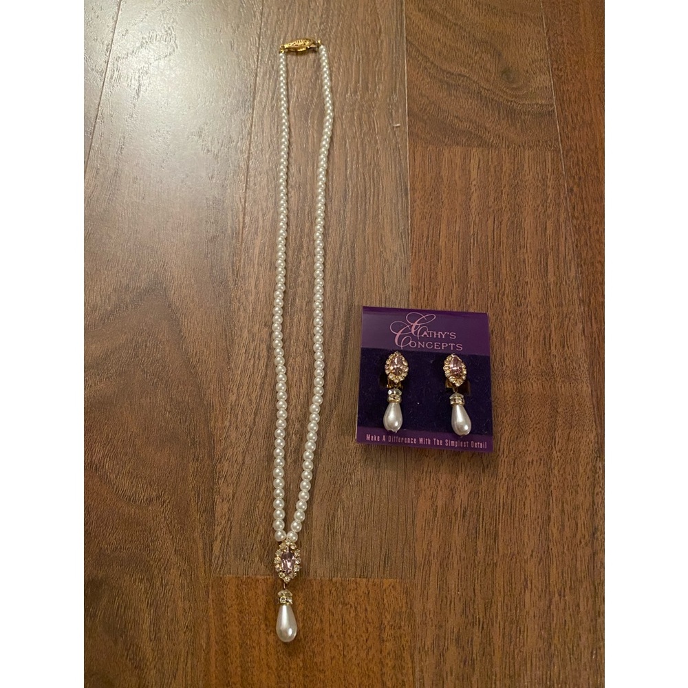Faux pearl necklace with drop pearl and lilac crystal charm. Matching earrings.